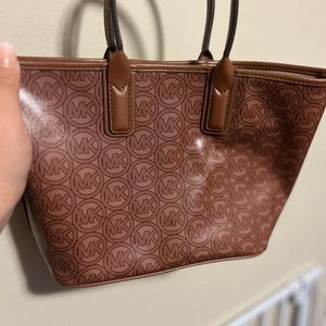 Small Michael Kors bag with MK logo print.